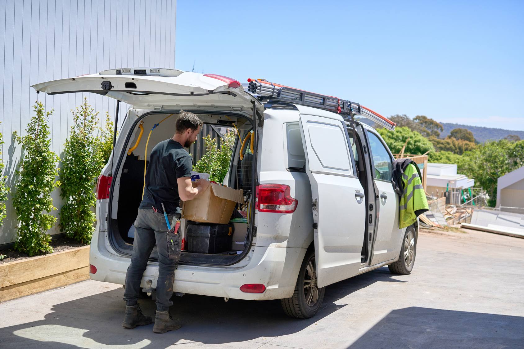 Electrician loading his van on site